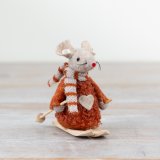 A charming felt mouse decoration in a rich, earthy hue with knitted scarf and wooden skis. 