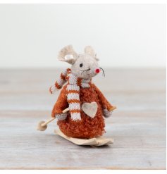 A charming felt mouse decoration in a rich, earthy hue with knitted scarf and wooden skis. 