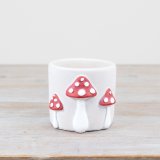 white planter with mushroom design 