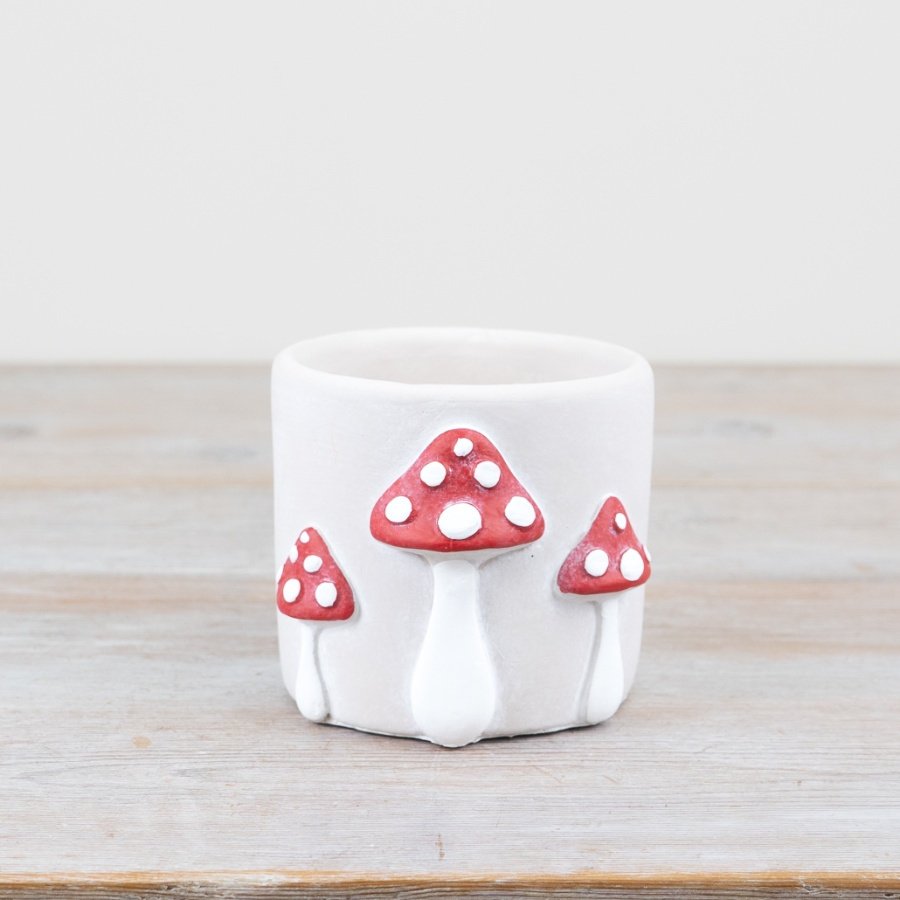 "Unique planter with whimsical mushroom design - perfect for showcasing your greenery in style. #whiteliving #decorins