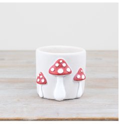 white planter with mushroom design 