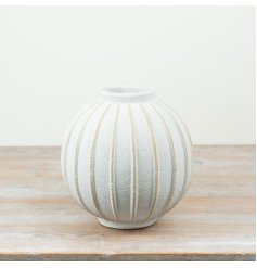 a sleek textured white vase 
