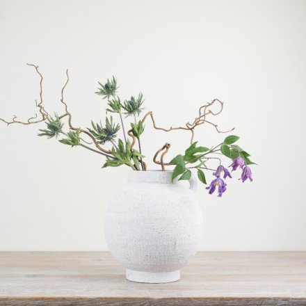 Enhance your home with our exquisite White Terracotta Vase, adding a charming touch of rustic elegance.