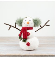 a small fabric sitting snowman