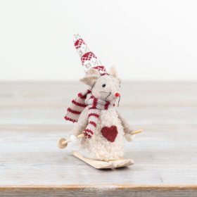 "Charming cream mouse enjoying winter fun on skis. Perfect for a playful touch to any décor."