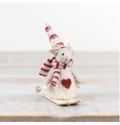 "Adorable cream mouse on skis for a charming touch to your decor."