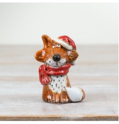 A quirky and unique festive fox ornament with Santa hat and scarf. Complete with a rich reactive glaze.