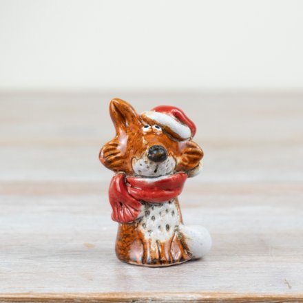 A rustic festive fox dressed with a Santa hat and scarf. Hand finished and with a beautiful reactive glaze. 