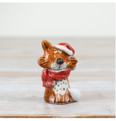 A rustic festive fox dressed with a Santa hat and scarf. Hand finished and with a beautiful reactive glaze. 