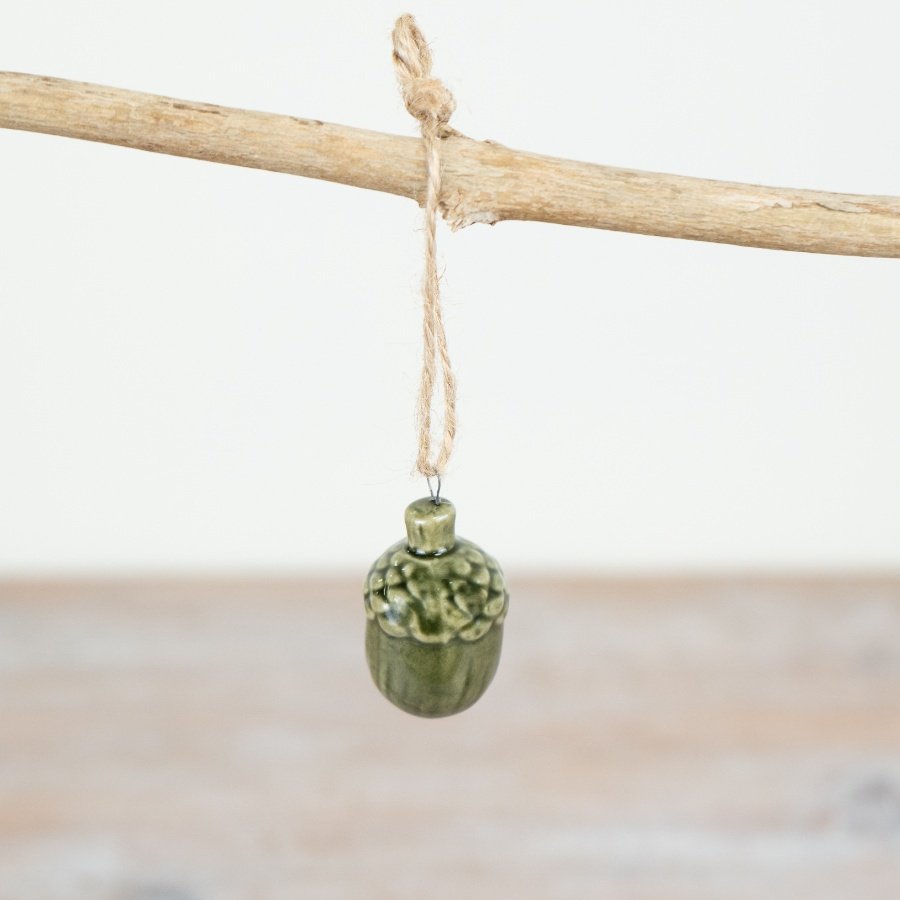 Add an elegant touch of nature to your holiday decor with our stunning Green Pinecone Jute Hanger for your home.