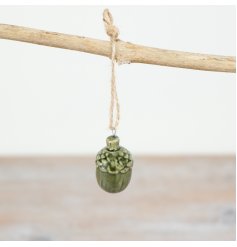 Add a touch of natural elegance to your home this holiday season with our beautiful Green Pinecone Jute Hanger! 