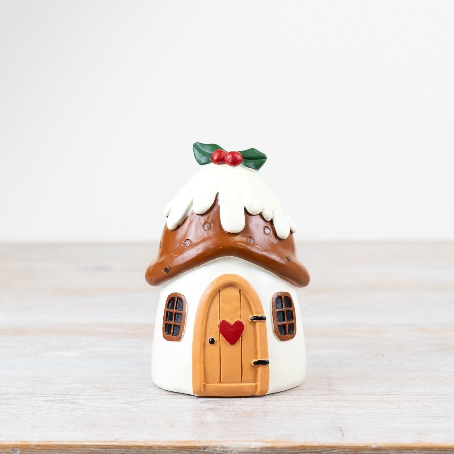 Add a touch of festive whimsy to the home with this delightful Christmas pudding house ornament.