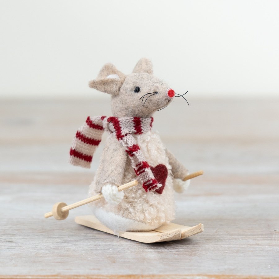 A charming felt mouse decoration with a knitted scarf and wooden skis. 