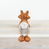 A unique and beautifully crafted fox decoration with quirky features and a rich reactive glaze.