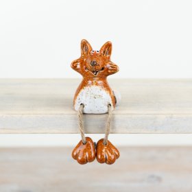 A charming fox ornament with jute string legs and ceramic feet. Beautifully crafted with a rich amber glaze. 