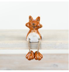 A unique and beautifully crafted fox decoration with quirky features and a rich reactive glaze.