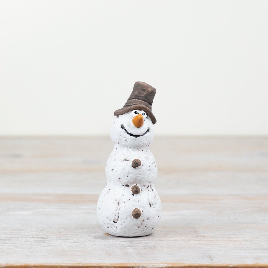 A rustic, hand finished snowman decoration. With a hand crafted aesthetic and matte finish. 