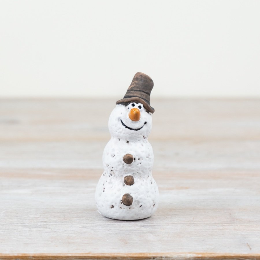 A rustic snowman ornament. Hand finished with quirky features and a matte glaze.