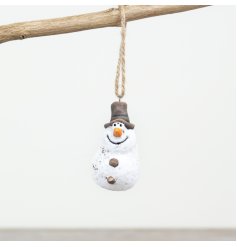 A rustic snowman ornament with jute string hanger. Hand finished with a beautifully textured matte surface.