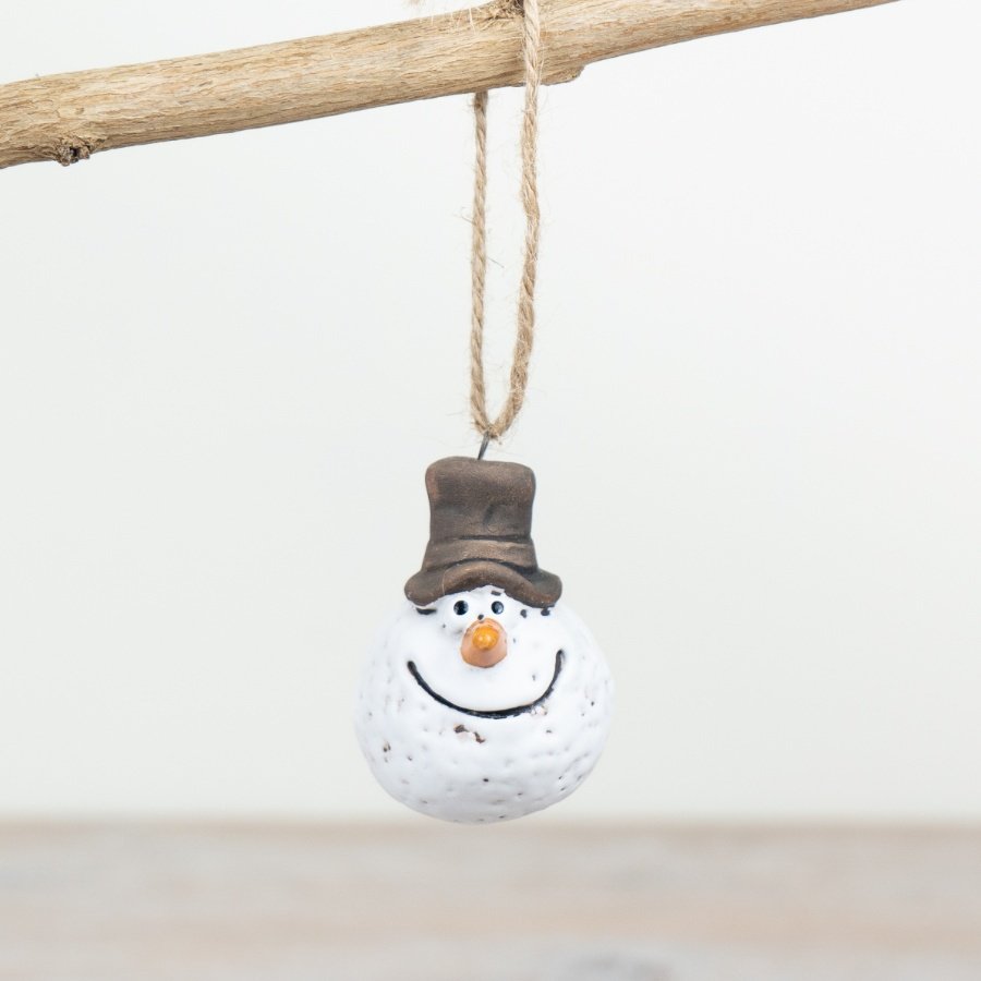 A quirky and unique snowman ornament with a rustic jute string hanger. Hand finished and beautifully textured. 