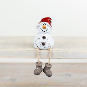 A rustic snowman shelf sitter with jute string legs. Complete with a glazed Santa hat and boots. 