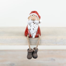 A charming and characterful sitting Santa ornament. Beautifully crafted and complete with a reactive glaze.