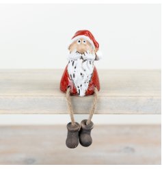 A charming and original shelf sitting santa. Hand finished with a glossy red reactive glaze.
