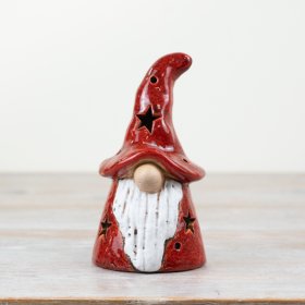 A rustic gonk figure in a rich red glaze. Beautifully crafted with star cut out details to reveal a warm glow light.