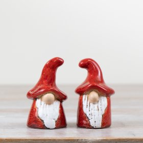 An assortment of 2 hand crafted gonk ornaments. Each is characterful in design and has a rich red reactive glaze.