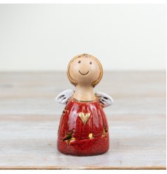 A charming angel decoration with hand finished details. Beautifully glazed with star cut outs to reveal warm glow lights