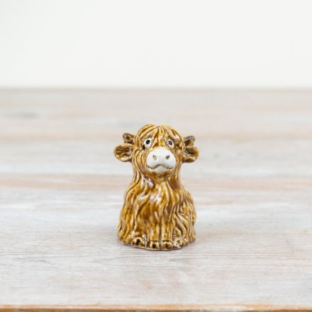Add rustic charm to the home with this unique and beautifully crafted highland cow ornament. 