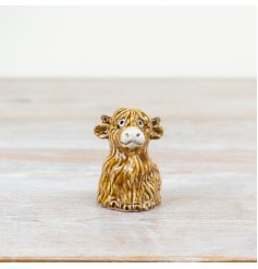 Add rustic charm to the home with this unique and beautifully crafted highland cow ornament. 