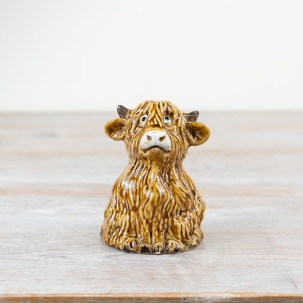 A rustic, hand finished highland cow ornament. Quirky and original. A must have item for the home. 