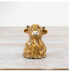A rustic, hand finished highland cow ornament. Quirky and original. A must have item for the home. 