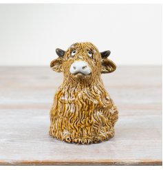 Add character and country charm to the home with this unique hand finished highland cow ornament. 