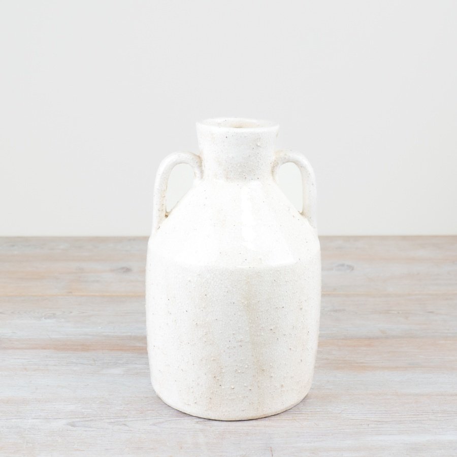 A delightful vase with handles perfect for displaying your favorite blooms.