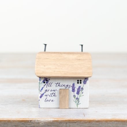 Charming flower-printed bock house for a playful touch to any space.