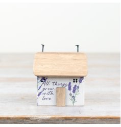 Charming flower-printed bock house for a playful touch to any space.