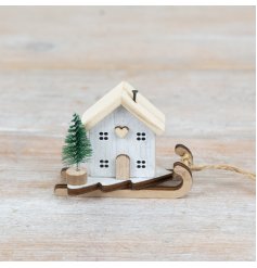 white festive house on sleigh 