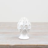 Add a touch of elegance to your holiday decor with our beautiful porcelain pine cone ornament.