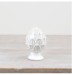 Decorate your home with our beautiful porcelain pine cone ornament. Bring the outdoors in this festive season.