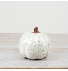 Add a touch of sophistication to your space with our charming Pumpkin figurine.