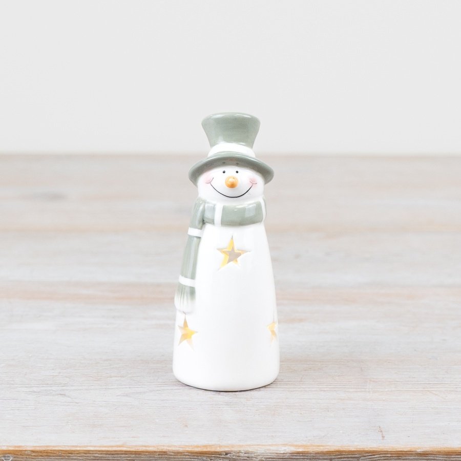 Add sparkle to your decor with this enchanting light up snowman in charming green and white shades.