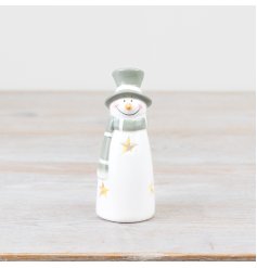 Light up your holiday decor with this charming snowman in shades of green and white!