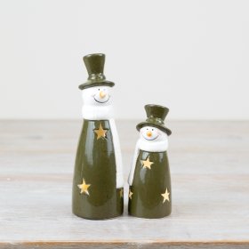 Brighten up your holiday décor with this mischievous light-up snowman in a vibrant shade of green! 