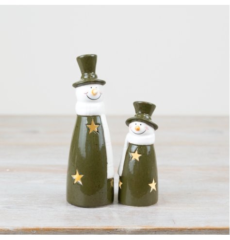 Playful light-up snowman in vibrant green. Fun addition to holiday decor. 