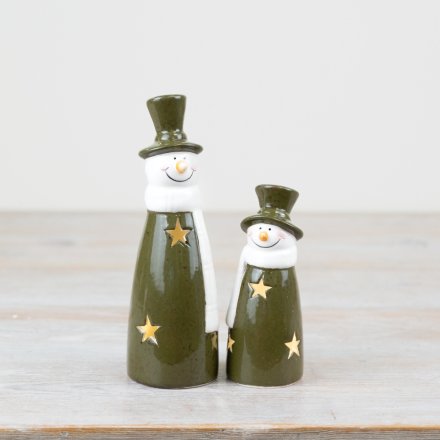 Playful light-up snowman in vibrant green. Fun addition to holiday decor. 
