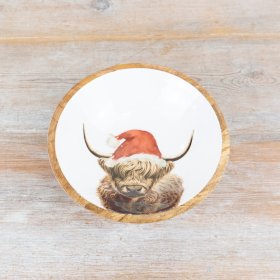 A unique and characterful mango wood bowl with an enamel centre featuring a gorgeous Highland Cow design.