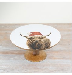 A sweet festive cake stand featuring our best-selling highland cow wearing a Christmas hat.