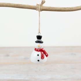 "Enhance your Christmas tree with a glazed snowman hanging ornament that brings a traditional charm."